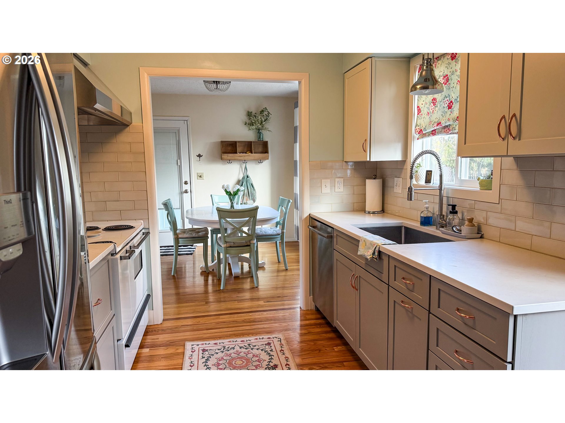 11734 Southeast Idleman Road Happy Valley, OR 97086 - Photo 12 of 48 a open kitchen with stainless steel appliances granite countertop a refrigerator and a sink