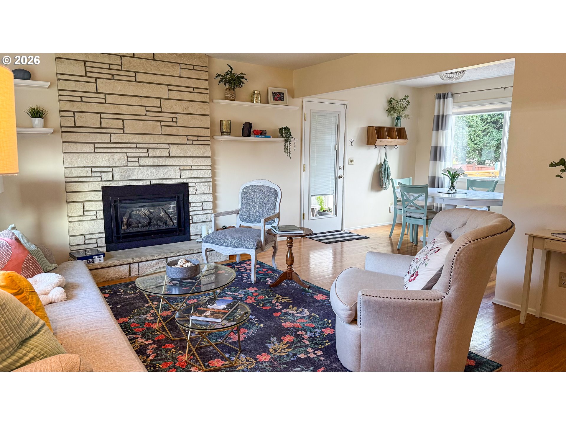 11734 Southeast Idleman Road Happy Valley, OR 97086 - Photo 15 of 48 a living room with furniture a fireplace and a table