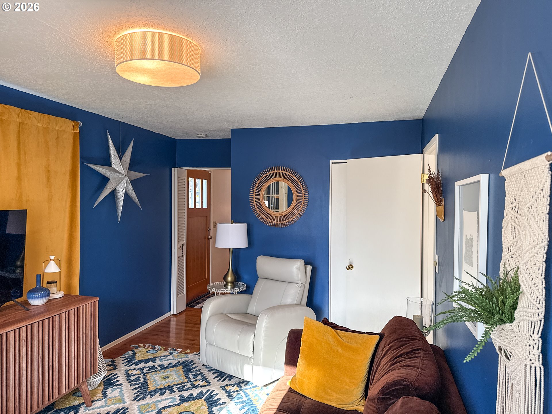 11734 Southeast Idleman Road Happy Valley, OR 97086 - Photo 21 of 48 a bedroom with a bed and a chandelier