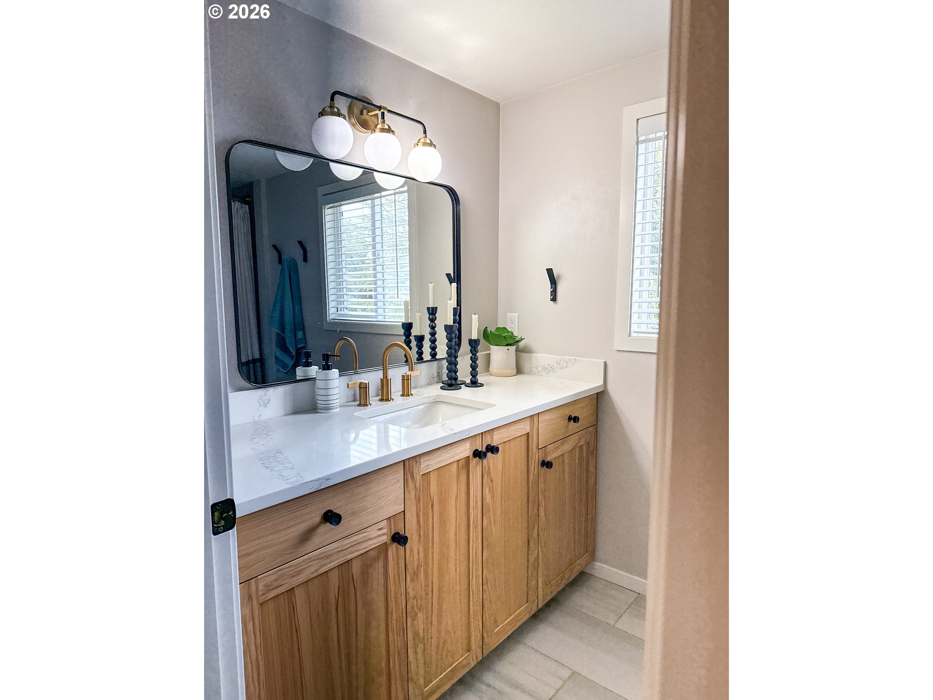 11734 Southeast Idleman Road Happy Valley, OR 97086 - Photo 28 of 48 a bathroom with a double vanity sink and a mirror