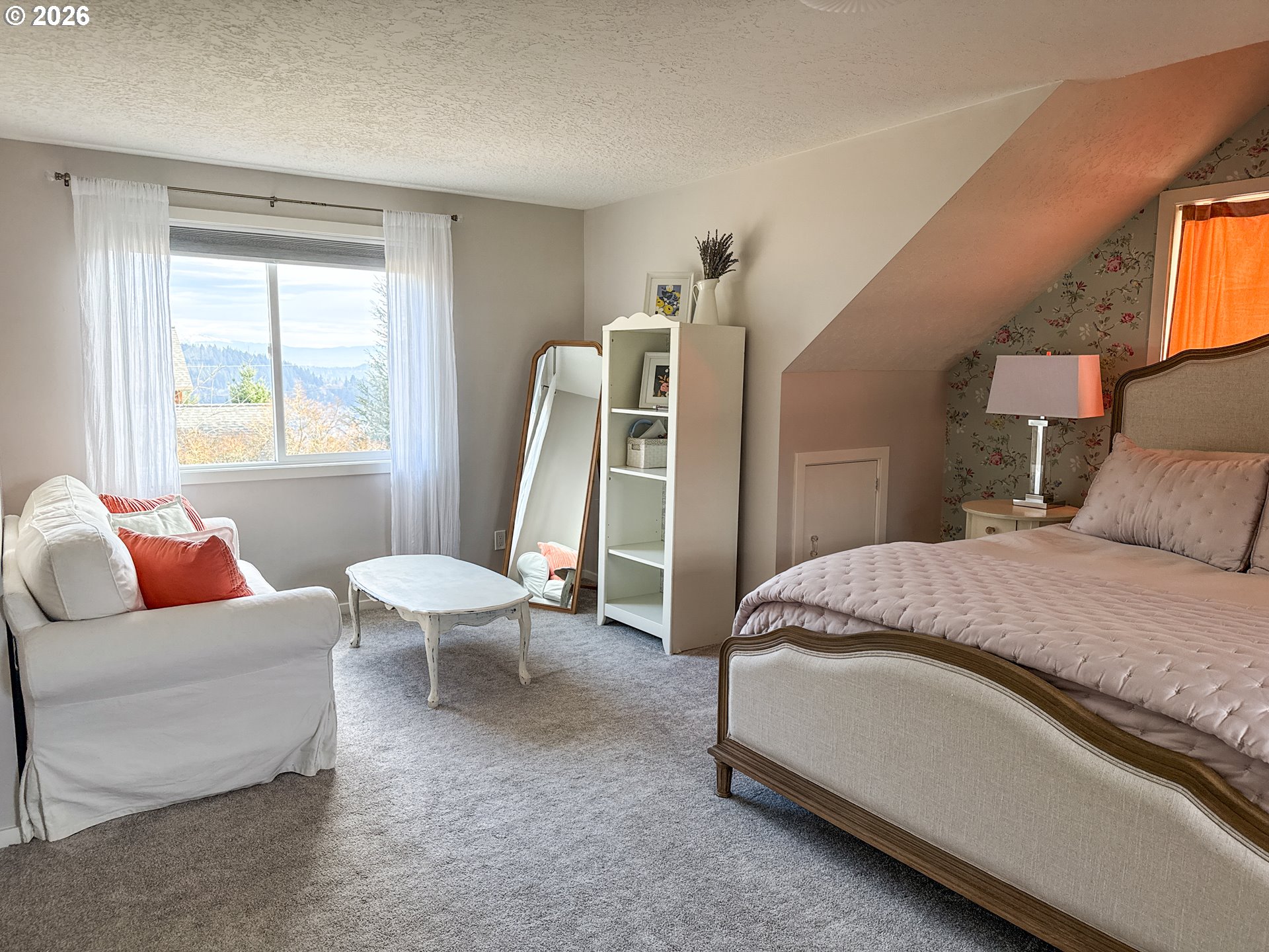 11734 Southeast Idleman Road Happy Valley, OR 97086 - Photo 31 of 48 a spacious bedroom with a bed and a couch