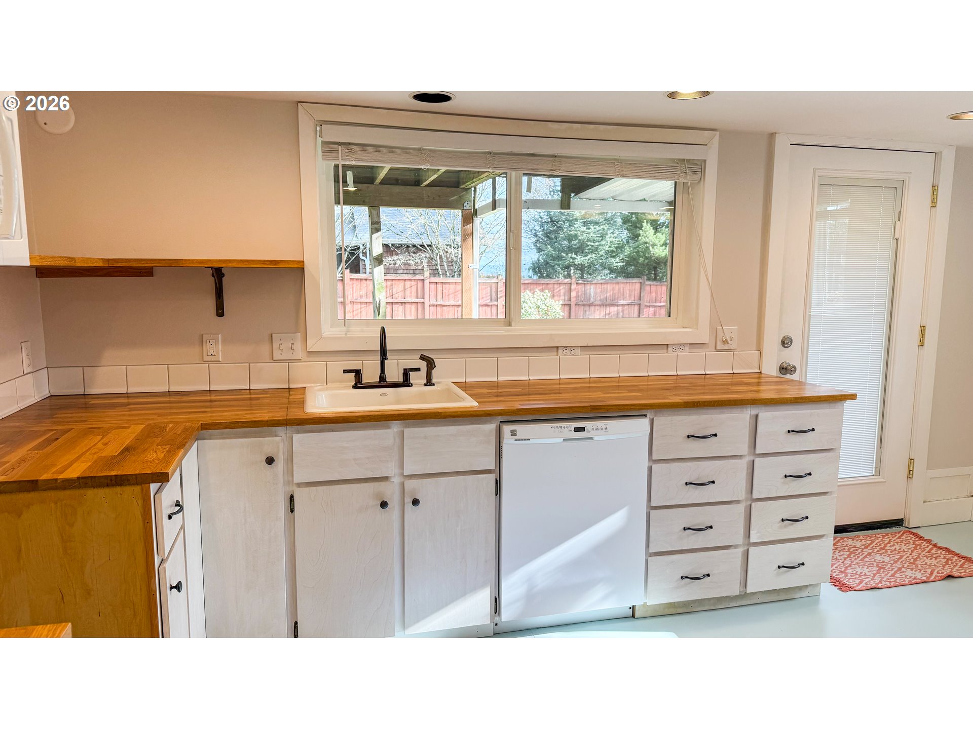 11734 Southeast Idleman Road Happy Valley, OR 97086 - Photo 35 of 48 a kitchen with a window a sink and a cabinets