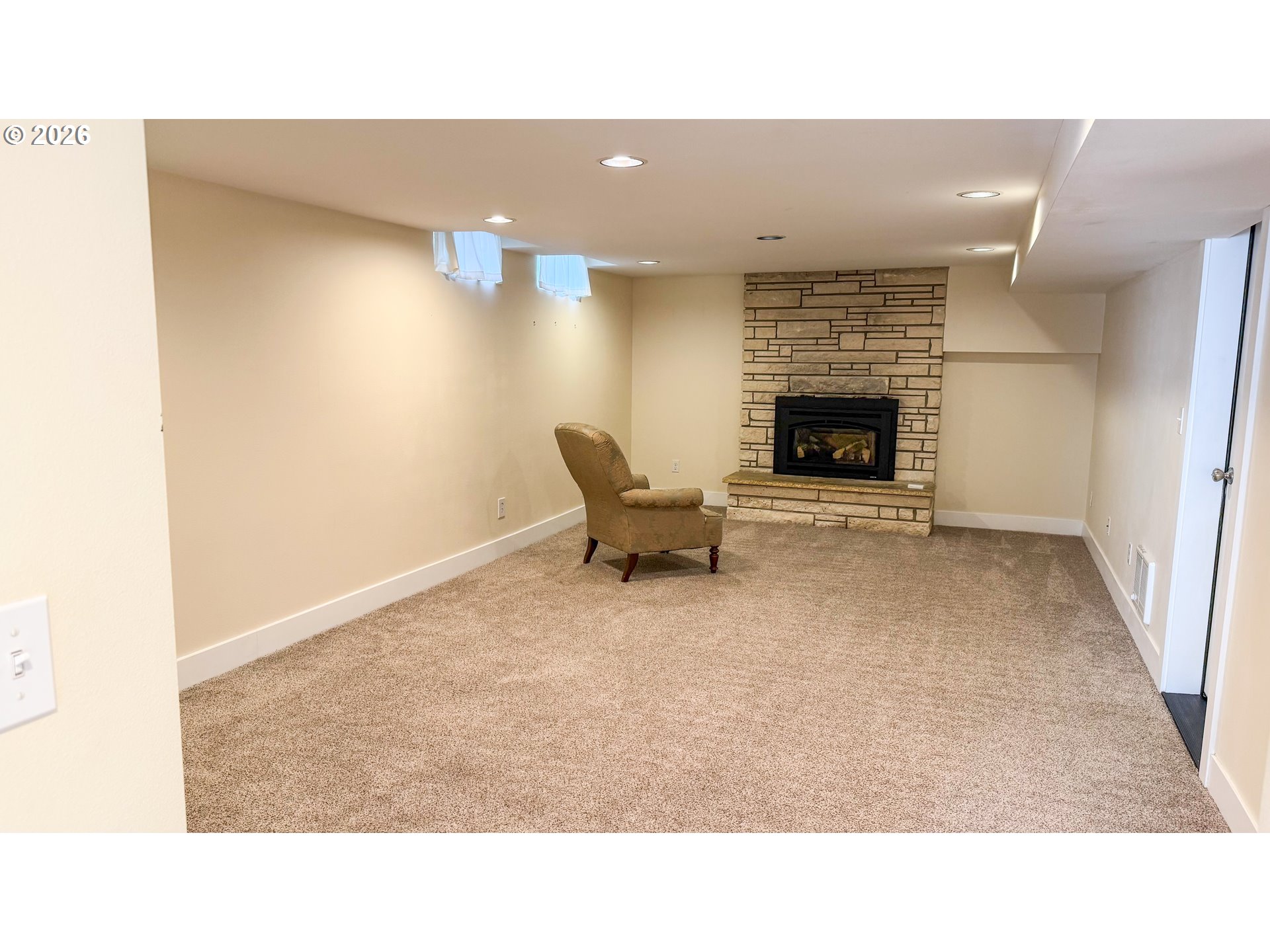 11734 Southeast Idleman Road Happy Valley, OR 97086 - Photo 37 of 48 a living room with furniture and a fireplace