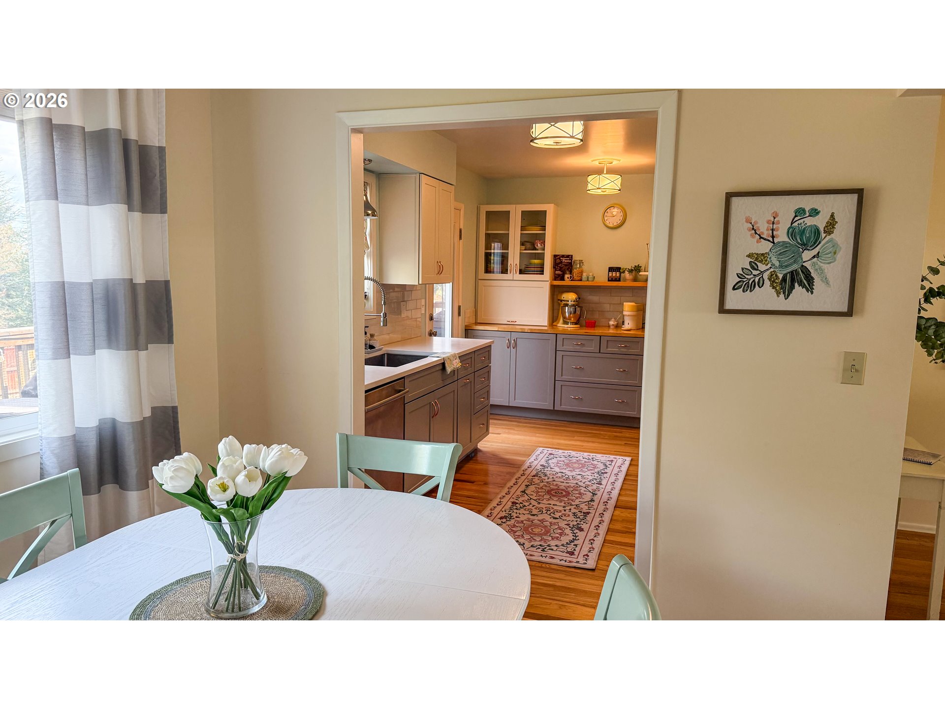 11734 Southeast Idleman Road Happy Valley, OR 97086 - Photo 7 of 48 a living room with couch and a potted plant