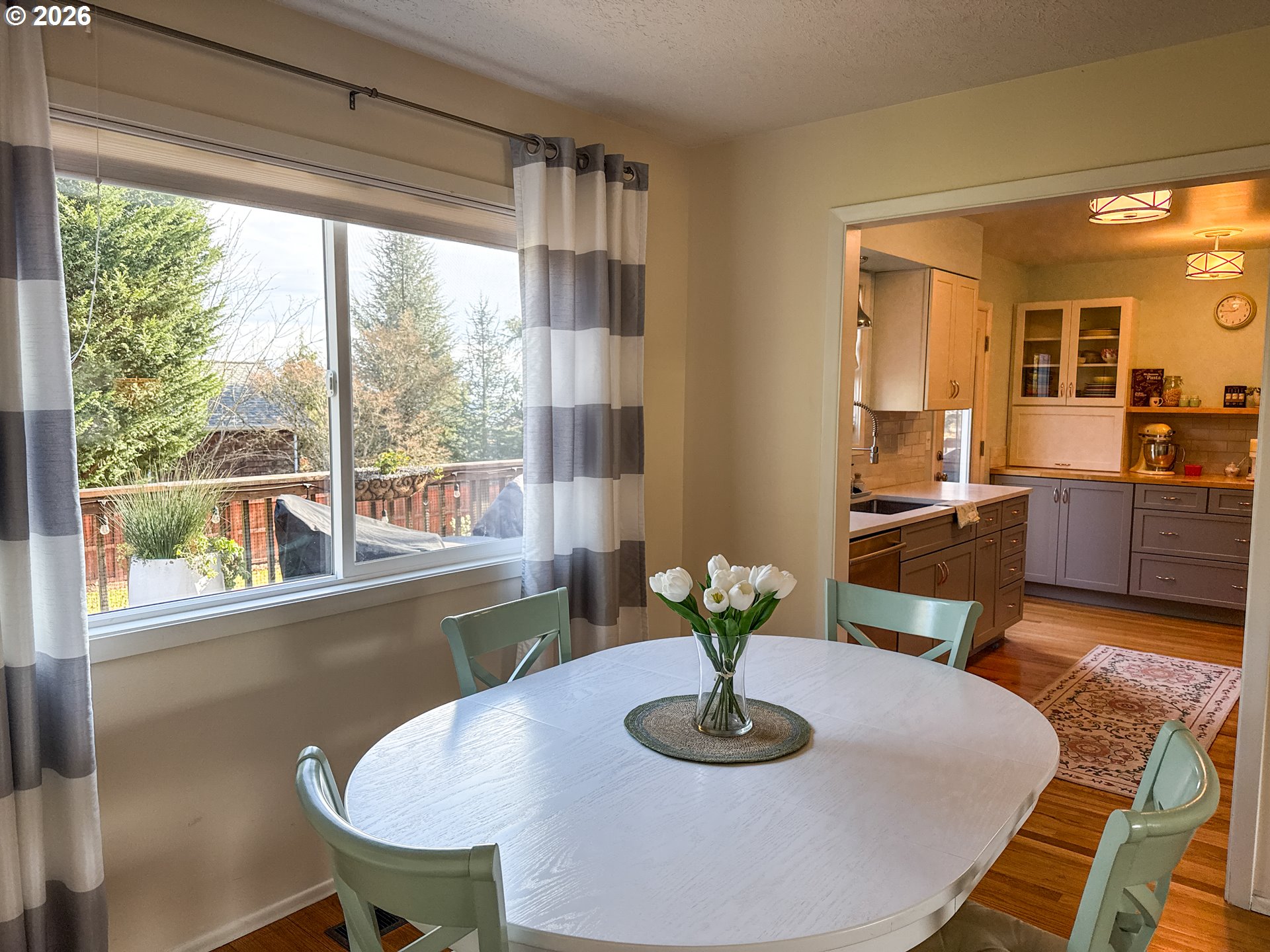 11734 Southeast Idleman Road Happy Valley, OR 97086 - Photo 8 of 48 a kitchen with a table and chairs