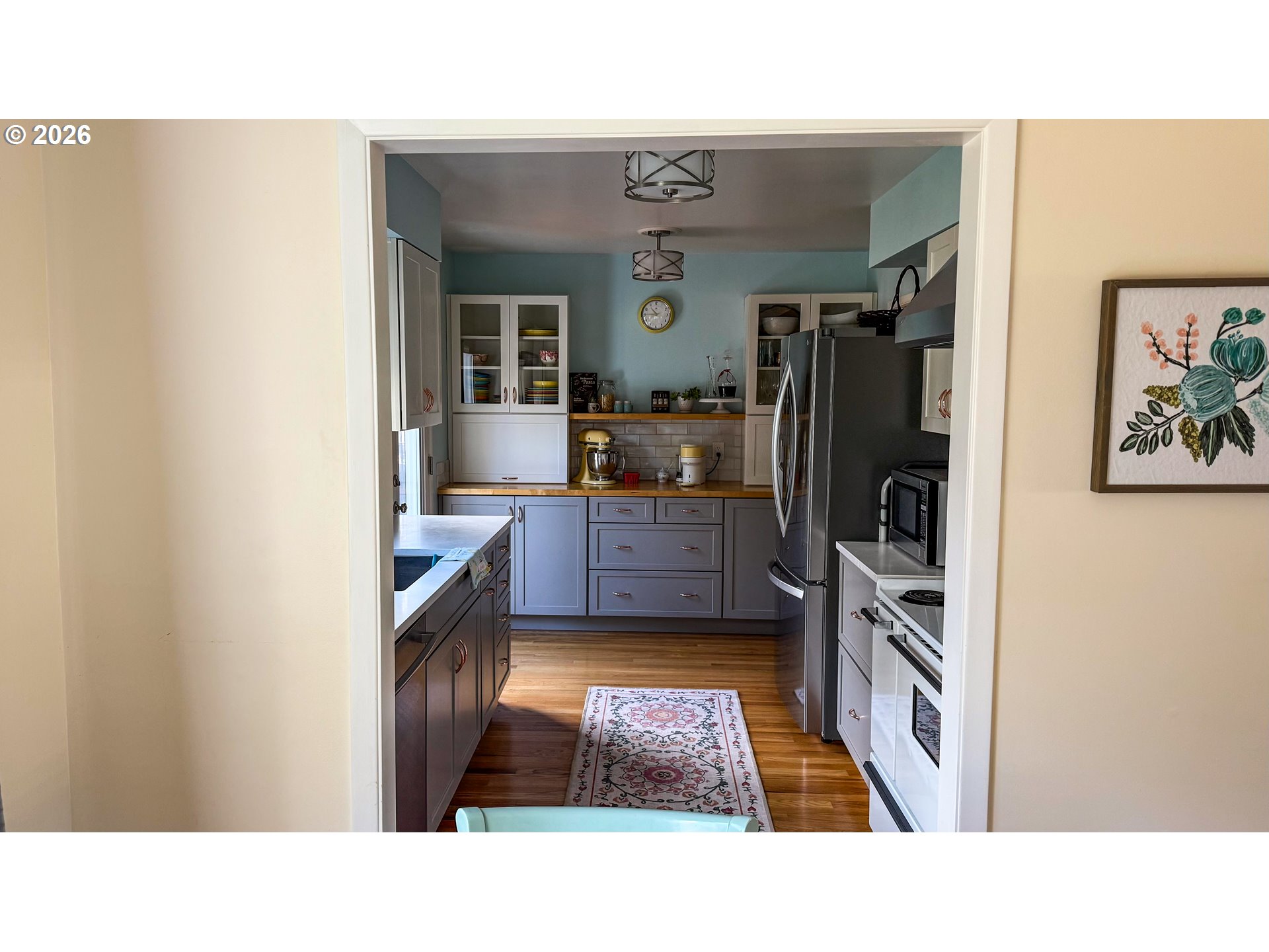 11734 Southeast Idleman Road Happy Valley, OR 97086 - Photo 9 of 48 a kitchen with stainless steel appliances granite countertop a refrigerator and a stove