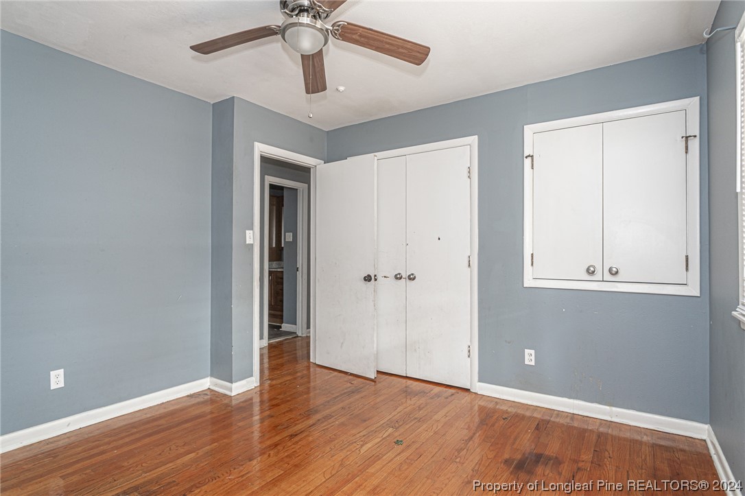 214 Lansdowne Road Fayetteville, NC 28314 - Photo 13 of 22 a view of an empty room with wooden floor