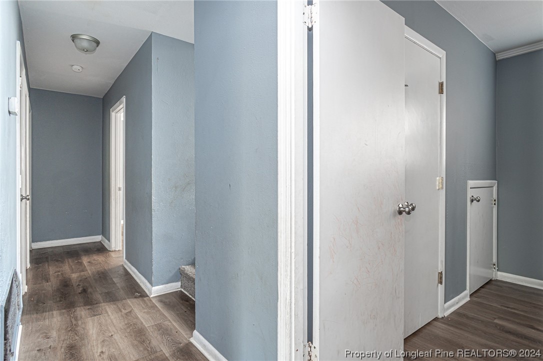 214 Lansdowne Road Fayetteville, NC 28314 - Photo 14 of 22 a view of a hallway with wooden floor and staircase