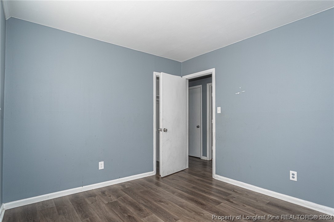 214 Lansdowne Road Fayetteville, NC 28314 - Photo 18 of 22 a view of an empty room with wooden floor and closet
