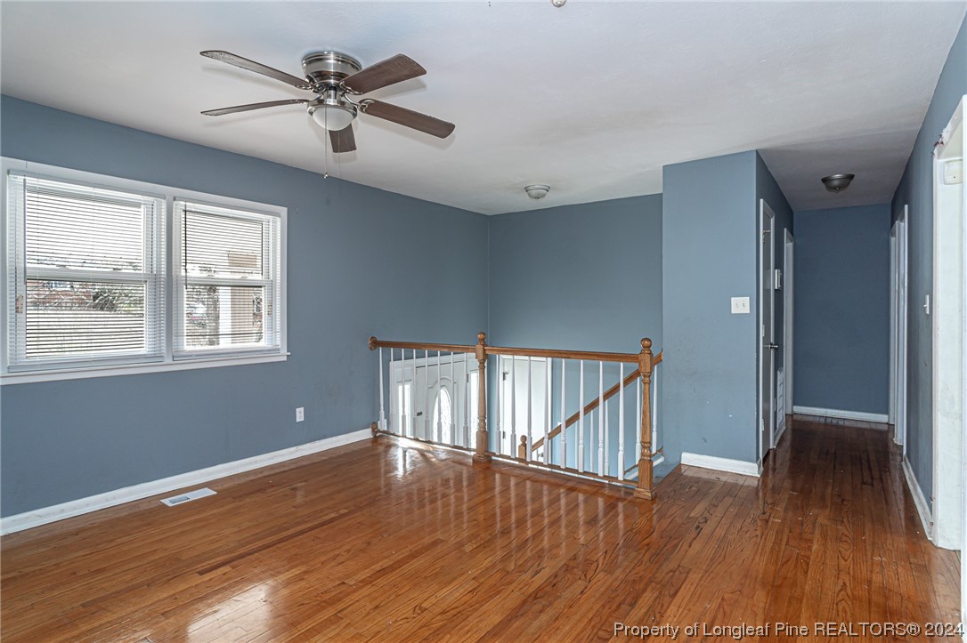214 Lansdowne Road Fayetteville, NC 28314 - Photo 3 of 22 a view of empty room with wooden floor and fan