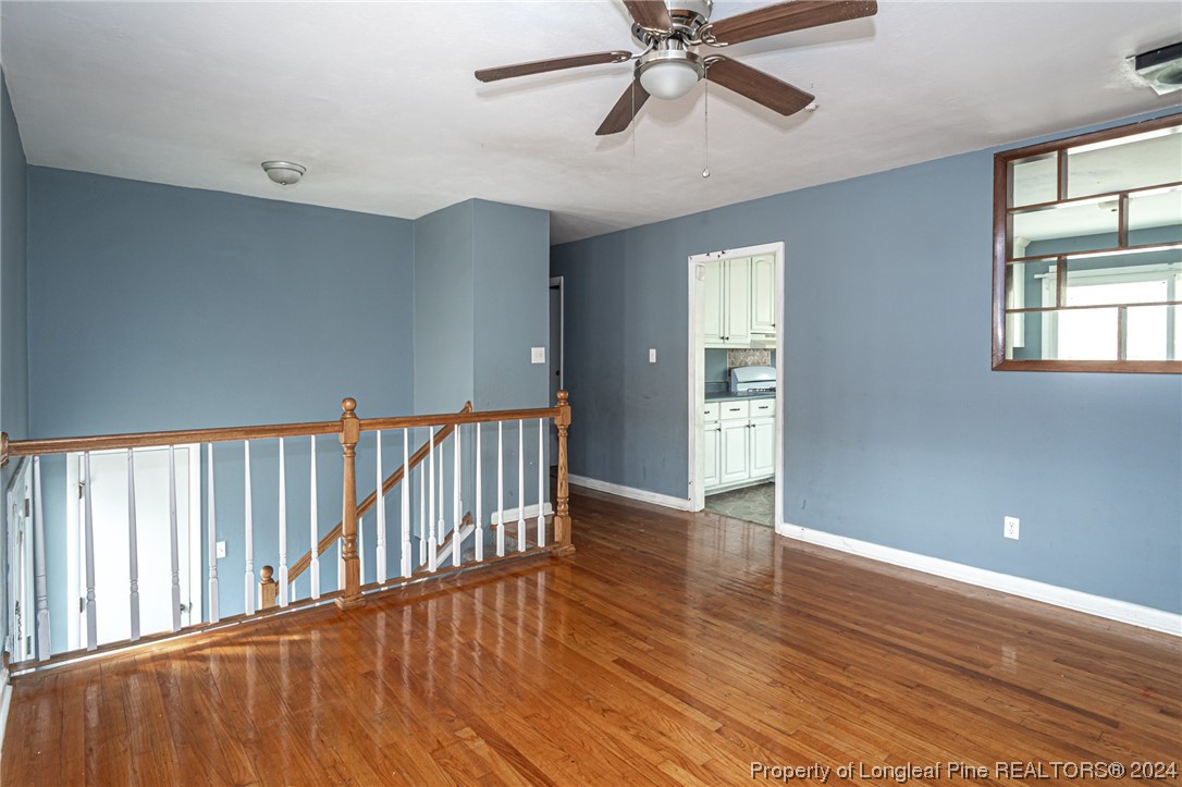 214 Lansdowne Road Fayetteville, NC 28314 - Photo 4 of 22 wooden floor in an empty room with a window