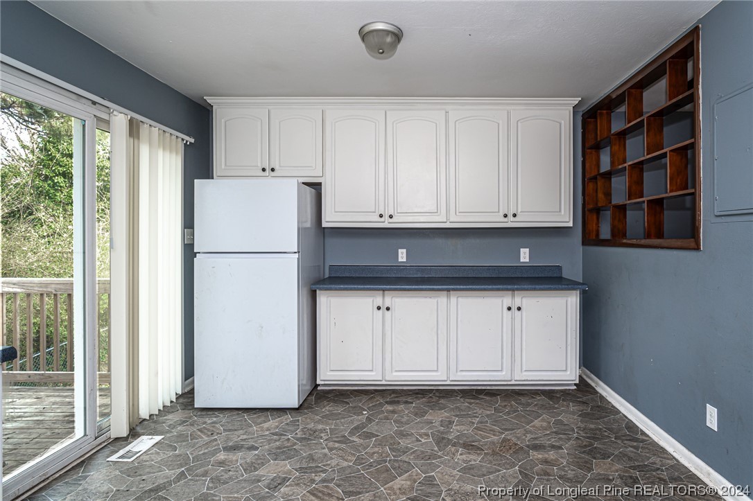 214 Lansdowne Road Fayetteville, NC 28314 - Photo 9 of 22 a view of cabinets and window