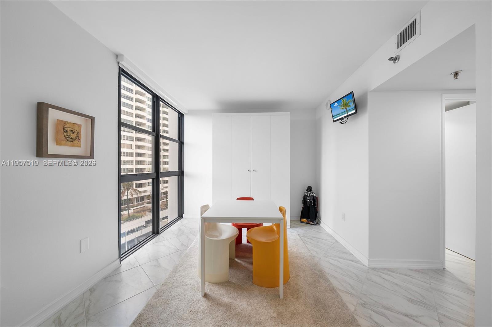 9 Island Avenue, Unit 710 Miami Beach, FL 33139 - Photo 11 of 15 a living room with furniture and a window