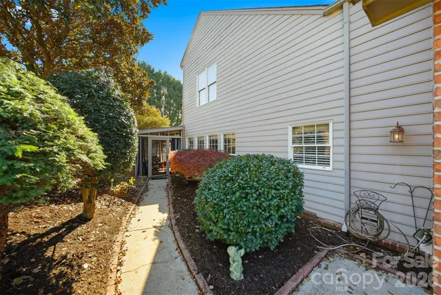 a view of a backyard with sitting area furniture and garden