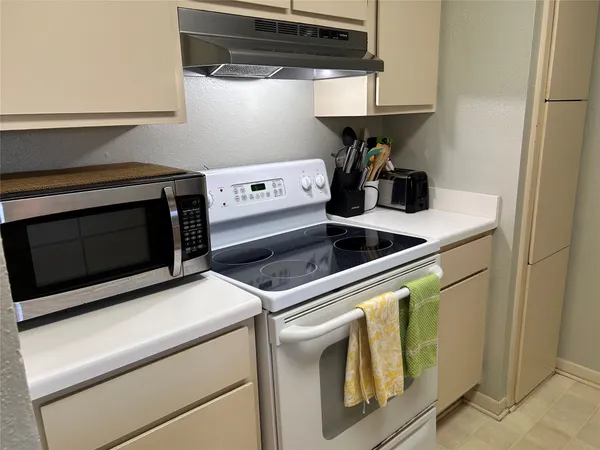 a kitchen that has a sink and a stove