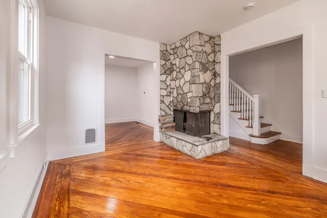 a view of fireplace and wooden floor