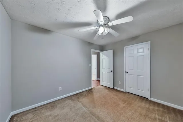 a view of a hallway with washer and dryer