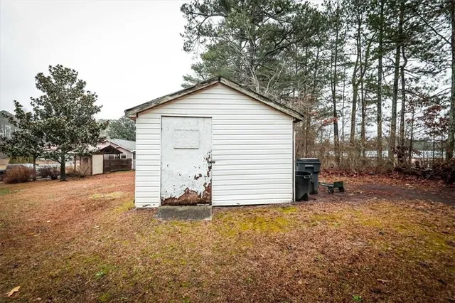 a view of a house with a yard and garage