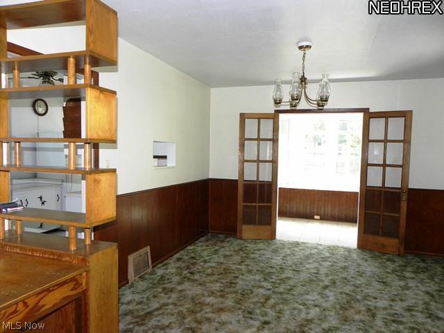 4018 Rosemond Road Cleveland Heights, OH 44121 - Photo 3 of 25 Carpeted formal dining room with French doors to sunroom.