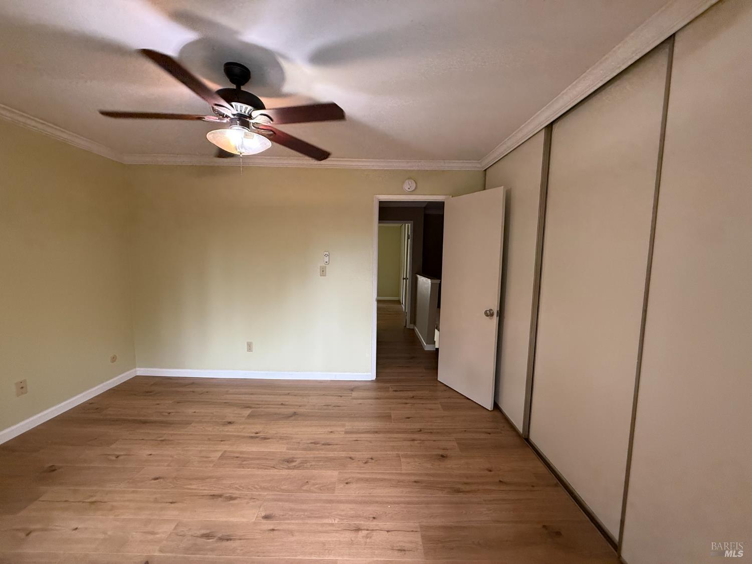 2161 Northwood Circle, Unit C Concord, CA 94520 - Photo 15 of 19 a view of a livingroom with a ceiling fan and wooden floor