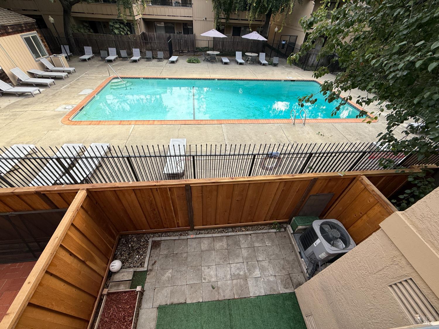 2161 Northwood Circle, Unit C Concord, CA 94520 - Photo 19 of 19 a view of a swimming pool with seating space
