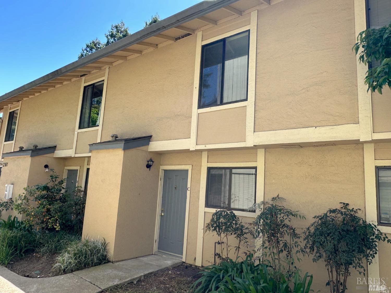2161 Northwood Circle, Unit C Concord, CA 94520 - Photo 3 of 19 front view of a house with a yard