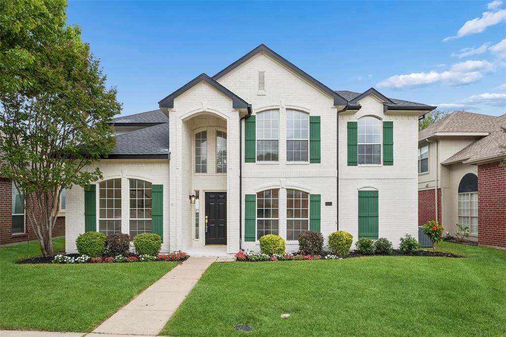 front view of a house with a yard