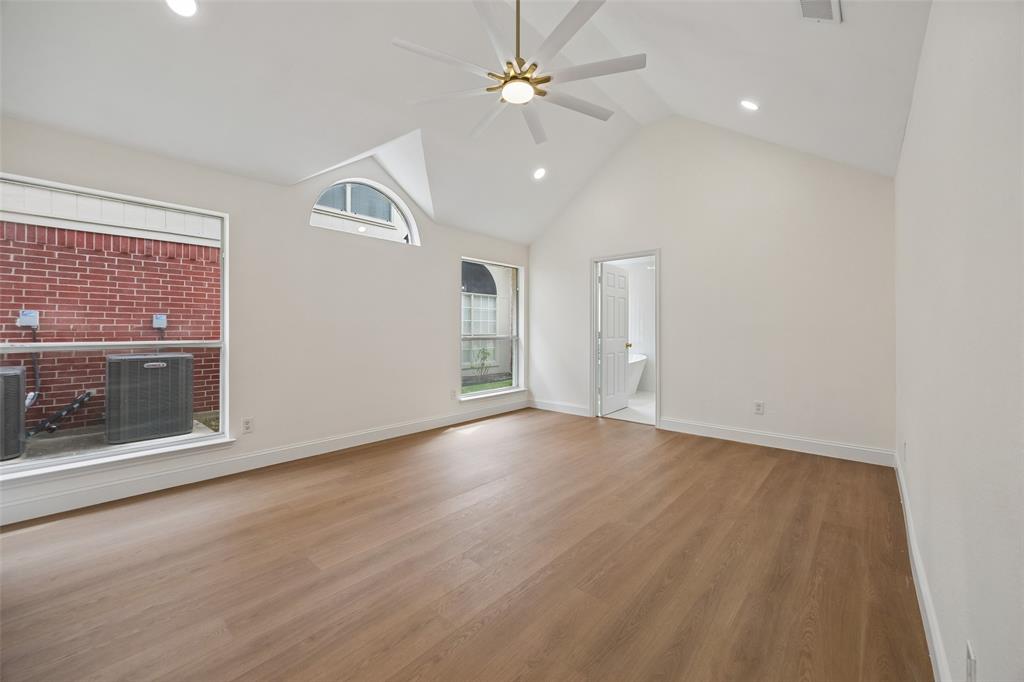 819 Kipling Drive Allen, TX 75002 - Photo 16 of 29 wooden floor in an empty room with a fireplace