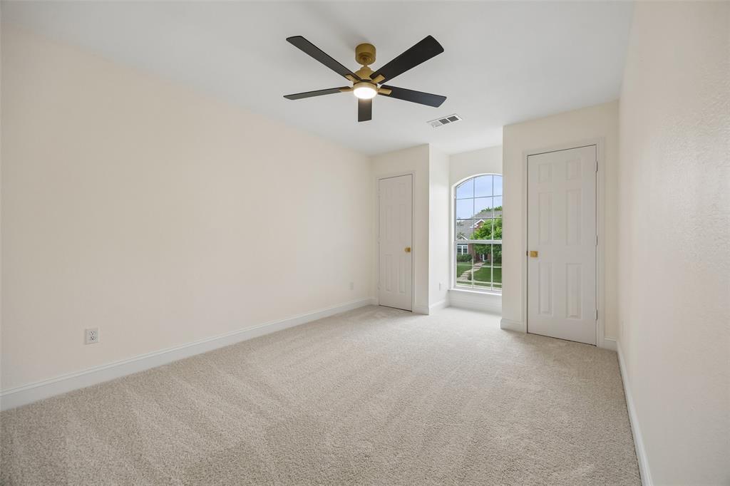 819 Kipling Drive Allen, TX 75002 - Photo 24 of 29 an empty room with closet and windows
