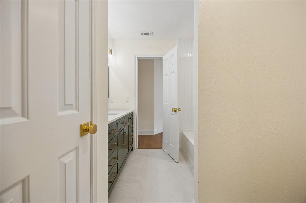 819 Kipling Drive Allen, TX 75002 - Photo 25 of 29 a view of a hallway with washer and dryer