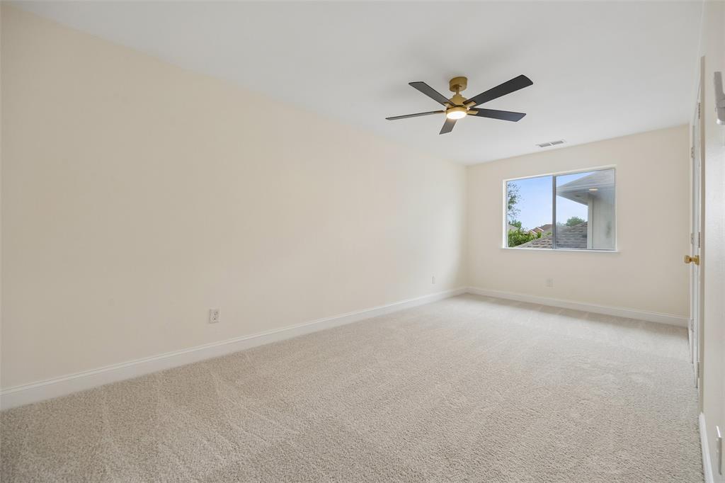 819 Kipling Drive Allen, TX 75002 - Photo 26 of 29 an empty room with windows and fan