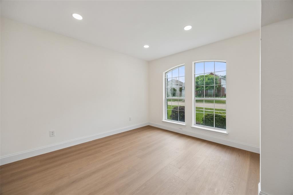 819 Kipling Drive Allen, TX 75002 - Photo 3 of 29 an empty room with wooden floor and windows
