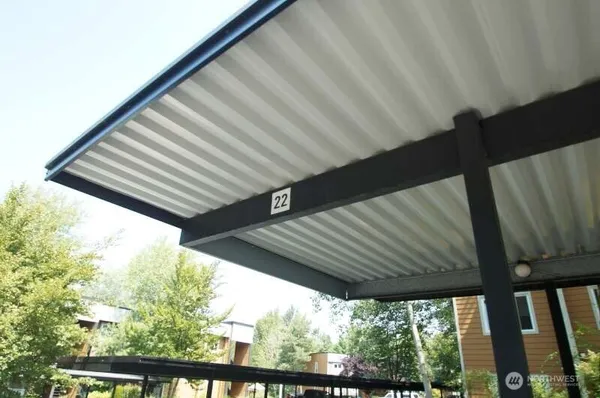 an aerial view of a house with outdoor seating