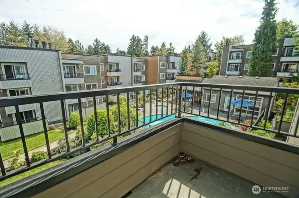 a view of a balcony with city view