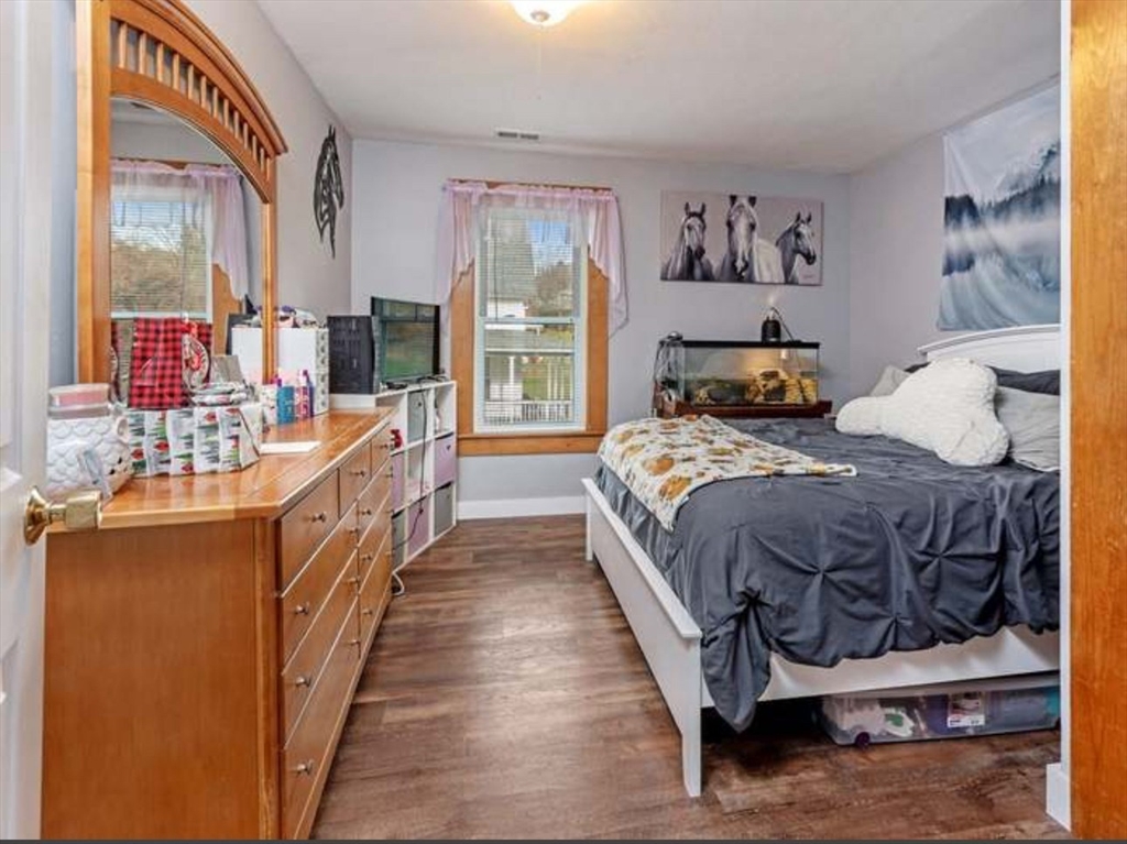 3 Orchard Street, Unit B Millbury, MA 01527 - Photo 12 of 17 a bedroom with a bed a couch and dresser