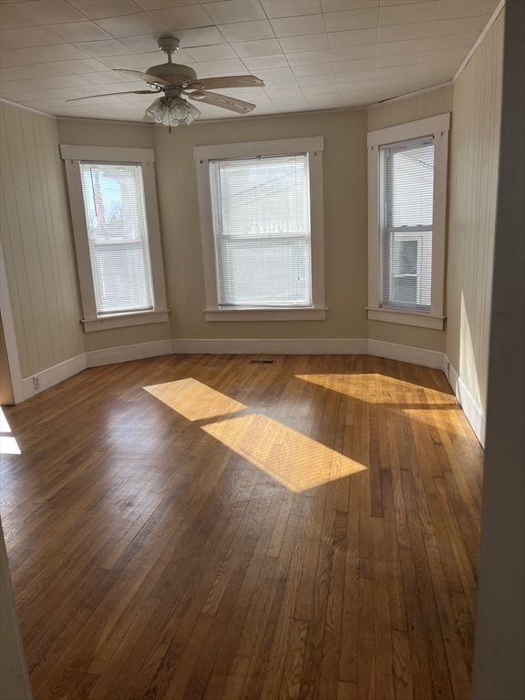 3 Orchard Street, Unit B Millbury, MA 01527 - Photo 2 of 17 a view of empty room with wooden floor and fan