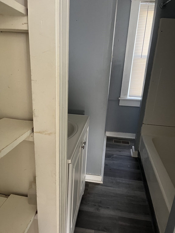 3 Orchard Street, Unit B Millbury, MA 01527 - Photo 6 of 17 a view of a hallway with wooden floor and staircase