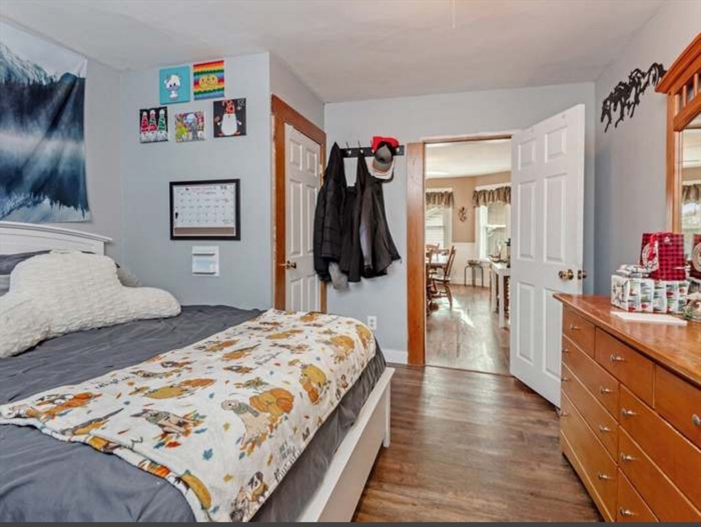 3 Orchard Street, Unit B Millbury, MA 01527 - Photo 10 of 17 a bedroom with a bed and a dresser