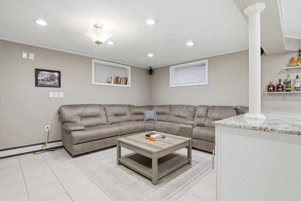 64 Browning Road Arlington, MA 02476 - Photo 19 of 25 a living room with furniture and a couch