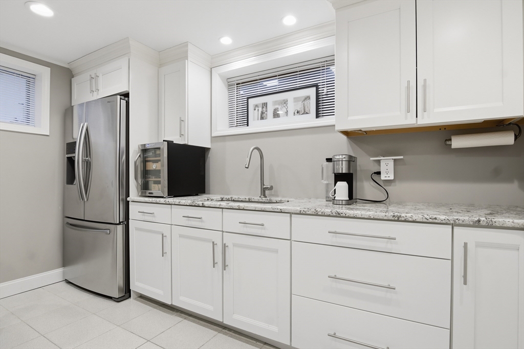64 Browning Road Arlington, MA 02476 - Photo 20 of 25 a kitchen with appliances a sink and cabinets