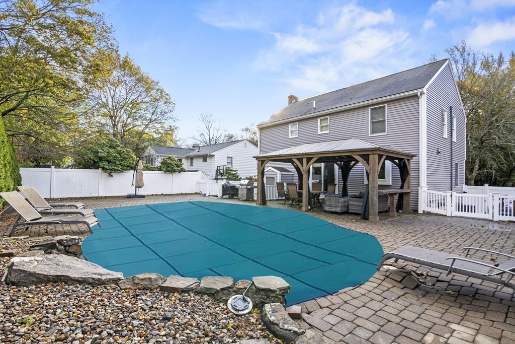 64 Browning Road Arlington, MA 02476 - Photo 22 of 25 a view of a house with backyard and sitting area