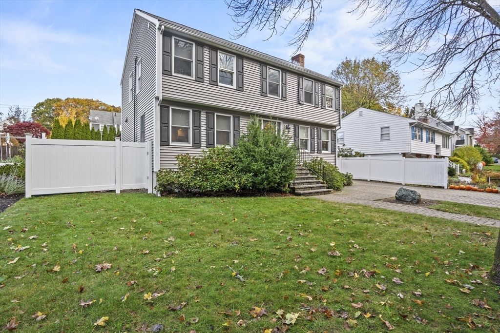 64 Browning Road Arlington, MA 02476 - Photo 24 of 25 a front view of house with yard and green space