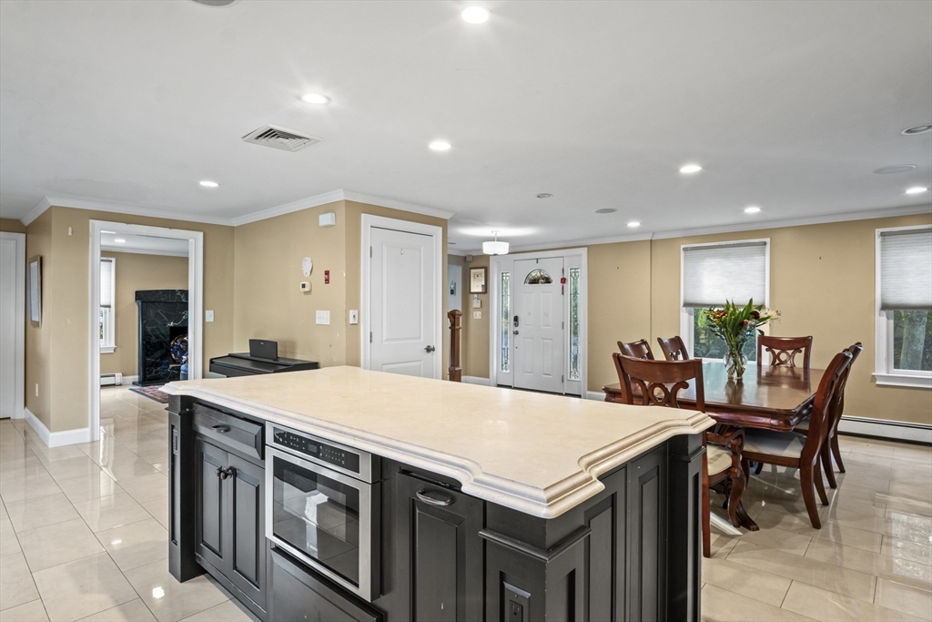 64 Browning Road Arlington, MA 02476 - Photo 4 of 25 a large kitchen with kitchen island a island in it