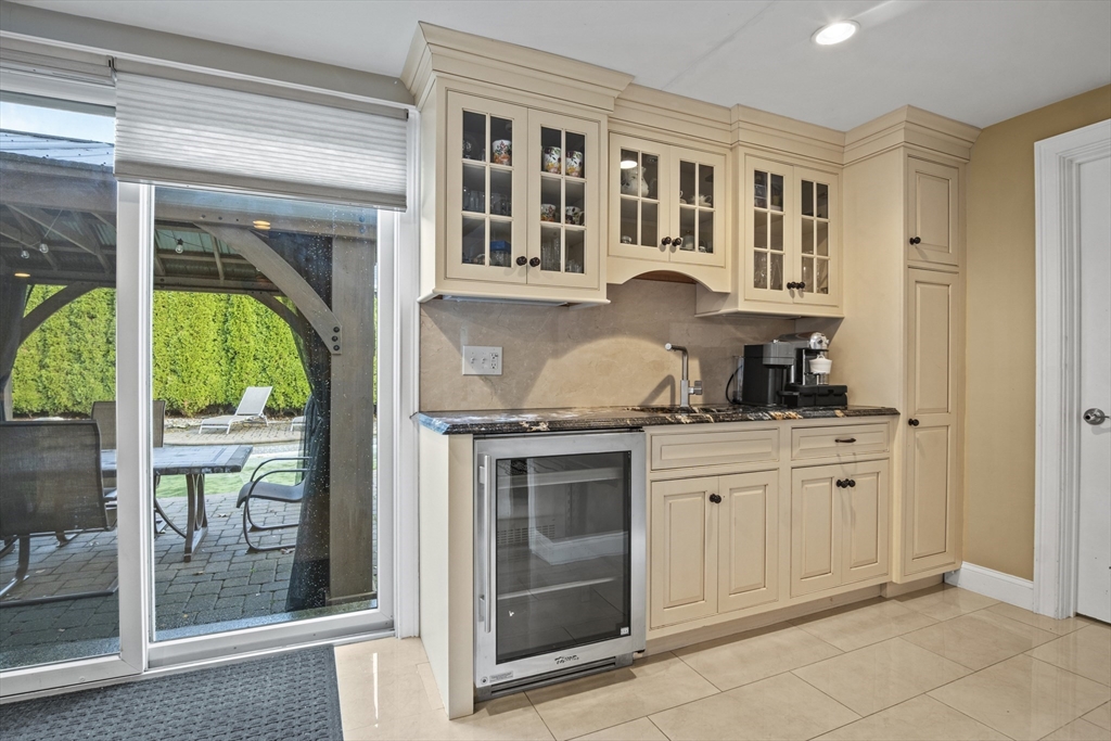 64 Browning Road Arlington, MA 02476 - Photo 5 of 25 a kitchen with granite countertop a stove a sink and a refrigerator