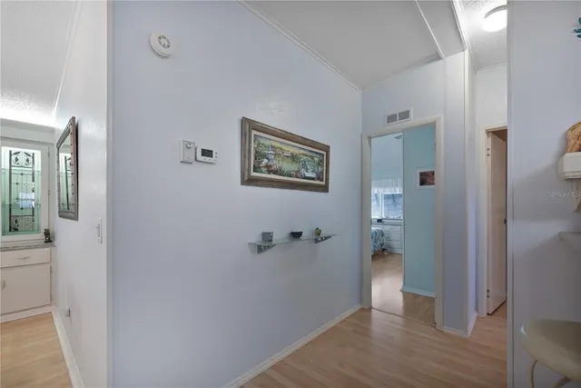 a living room with furniture a rug and a chandelier