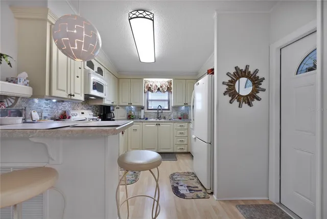 a bathroom with a sink vanity and a mirror