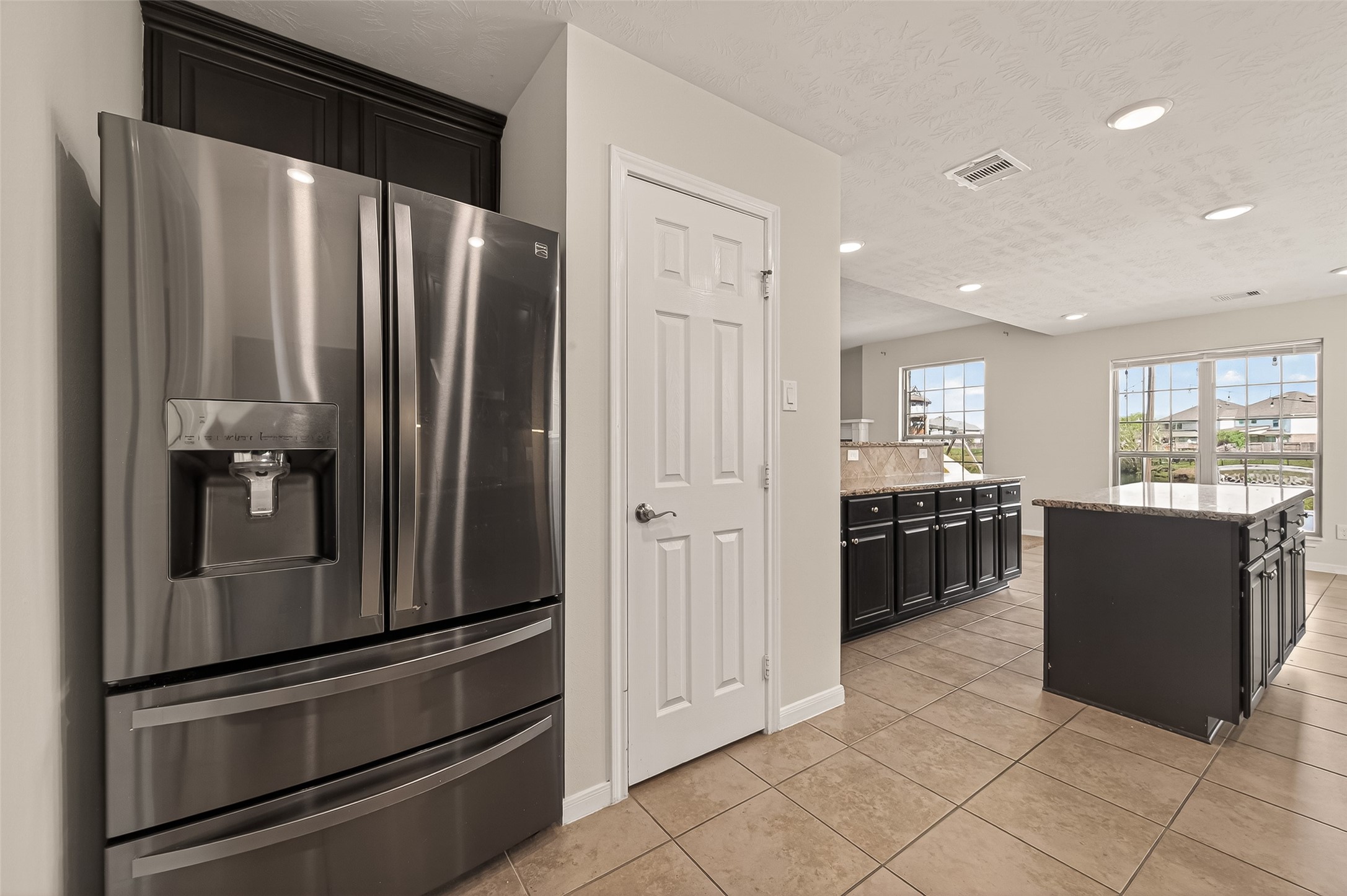 29 Palmero Way Manvel, TX 77578 - Photo 12 of 31 Convenient walk-in pantry for added storage. Stainless steel refrigerator conveys with the sale.