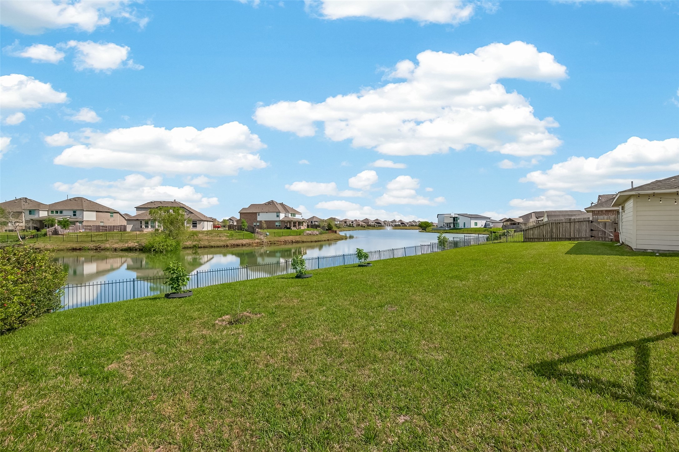 29 Palmero Way Manvel, TX 77578 - Photo 2 of 31 Spacious backyard with serene lake views and no rear neighbors.