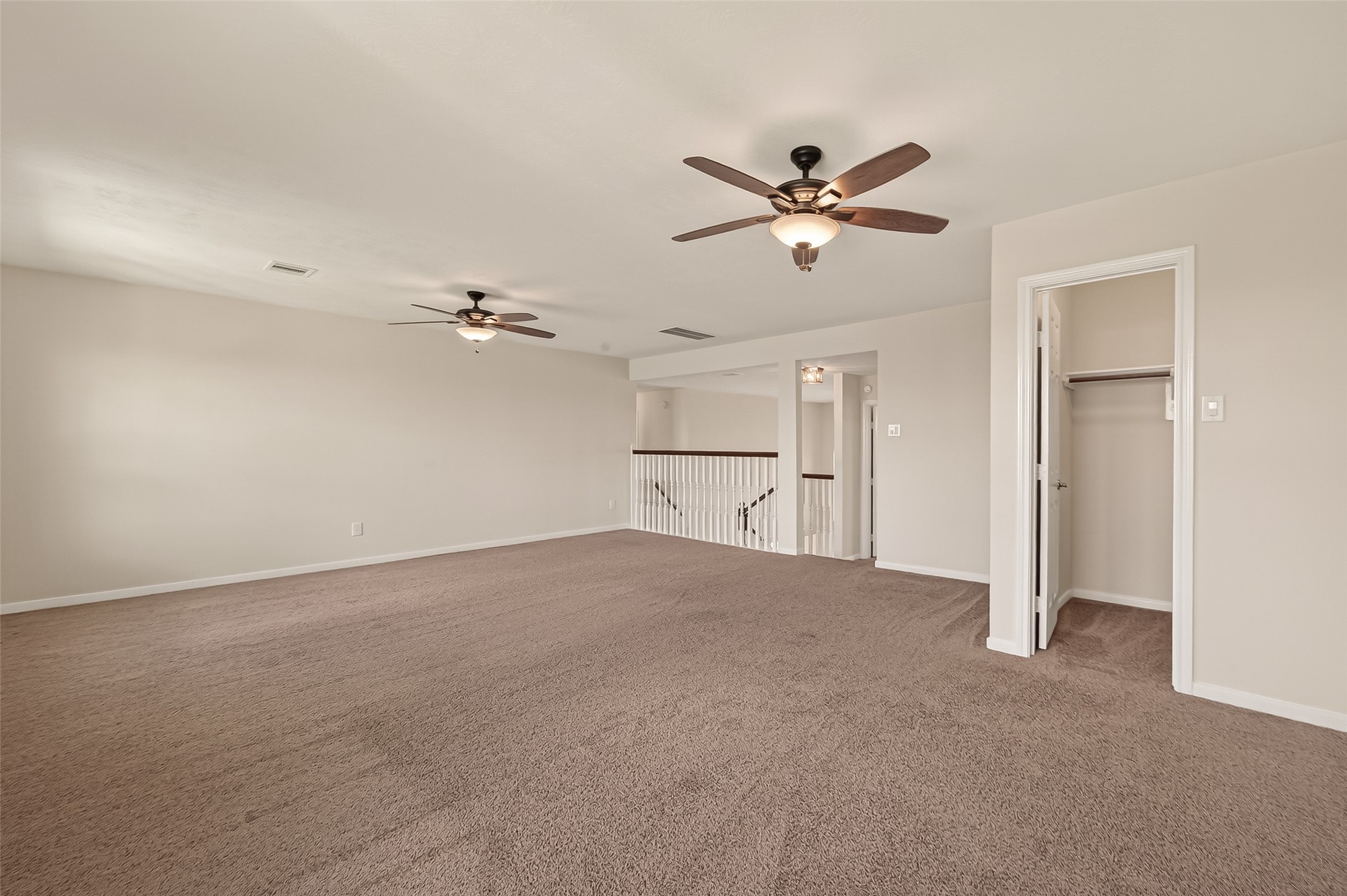 29 Palmero Way Manvel, TX 77578 - Photo 23 of 31 Alternate view of upstairs flex space with closet, offering added storage and functionality.
