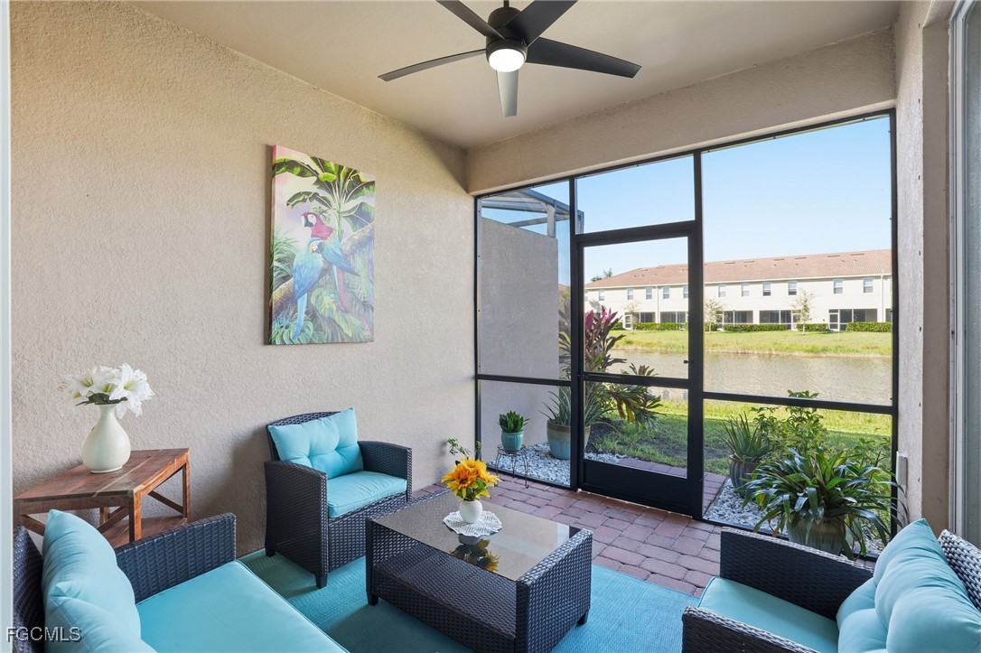 2617 Vine Avenue Naples, FL 34120 - Photo 11 of 27 a living room with furniture and a large window